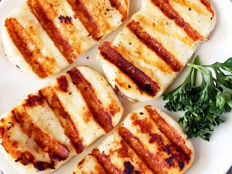 Close-up view of grilled halloumi cheese on a plate