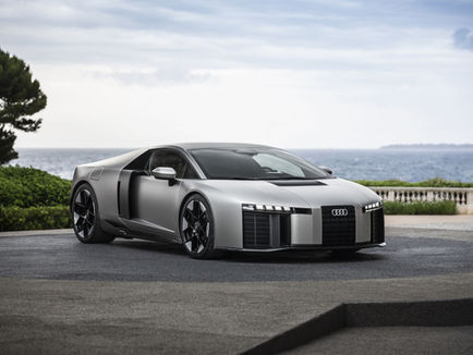 Audi Nuvolari i dynamisk miljö- eller pressbild med låg superbilskaross, bred hållning och tydligt framtidsinriktad Audi-design.