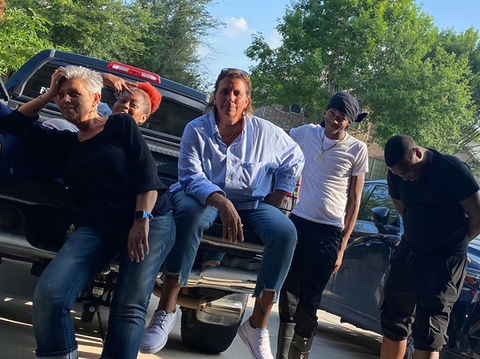 StrongStart team taking a break in the back of a truck