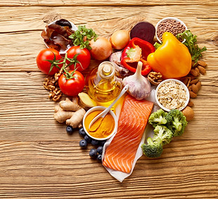 Healthy food ingredients in shape of love heart on wooden table with copy space.jpg
