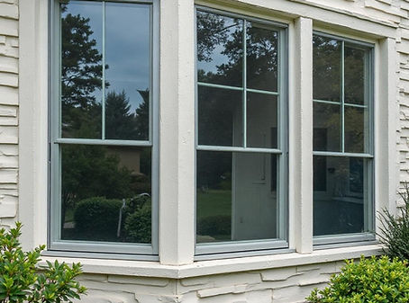 Residential home in Jeffersonville IN with tinted security film for added privacy and storm protection.