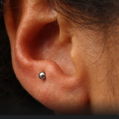 Ear with anti-tragus piercing
