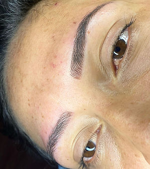 Client's eyebrows after our microblading process