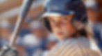 young-female-baseball-player-helmet-uniform-holding-bat-stares-intensely-camera.jpg