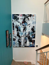View of painting when it is hanging on a white wall
