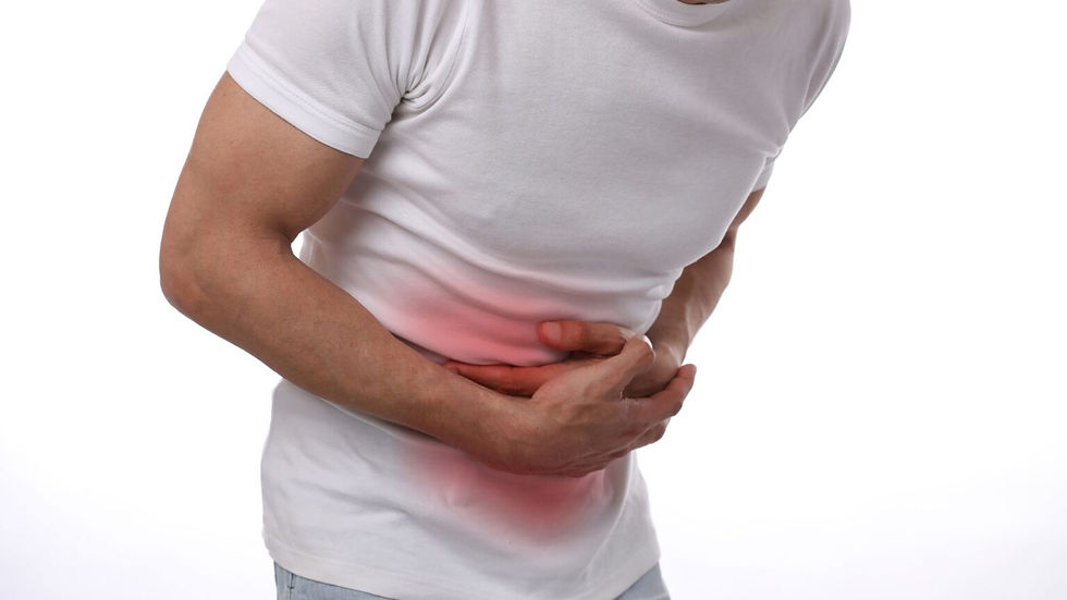 Man clutching stomach with abdominal pain