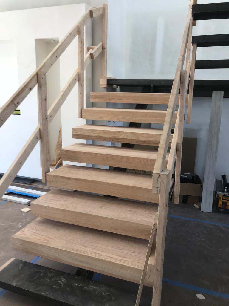 Floating staircase with white oak treads, in fabrication