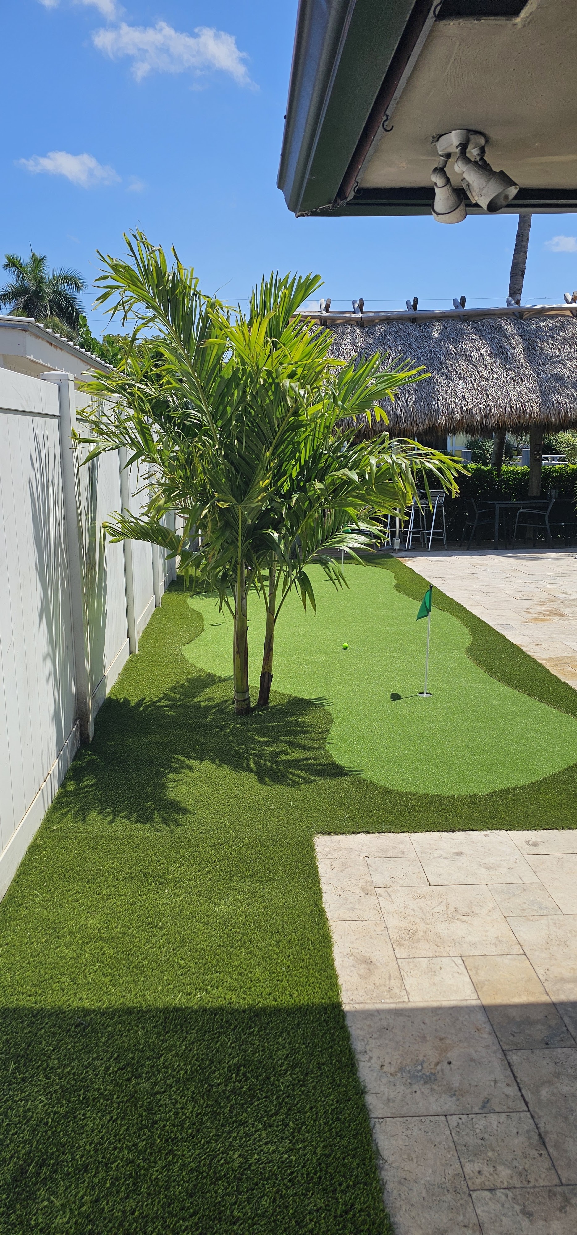 Artificial turf putting green installed in a private backyard