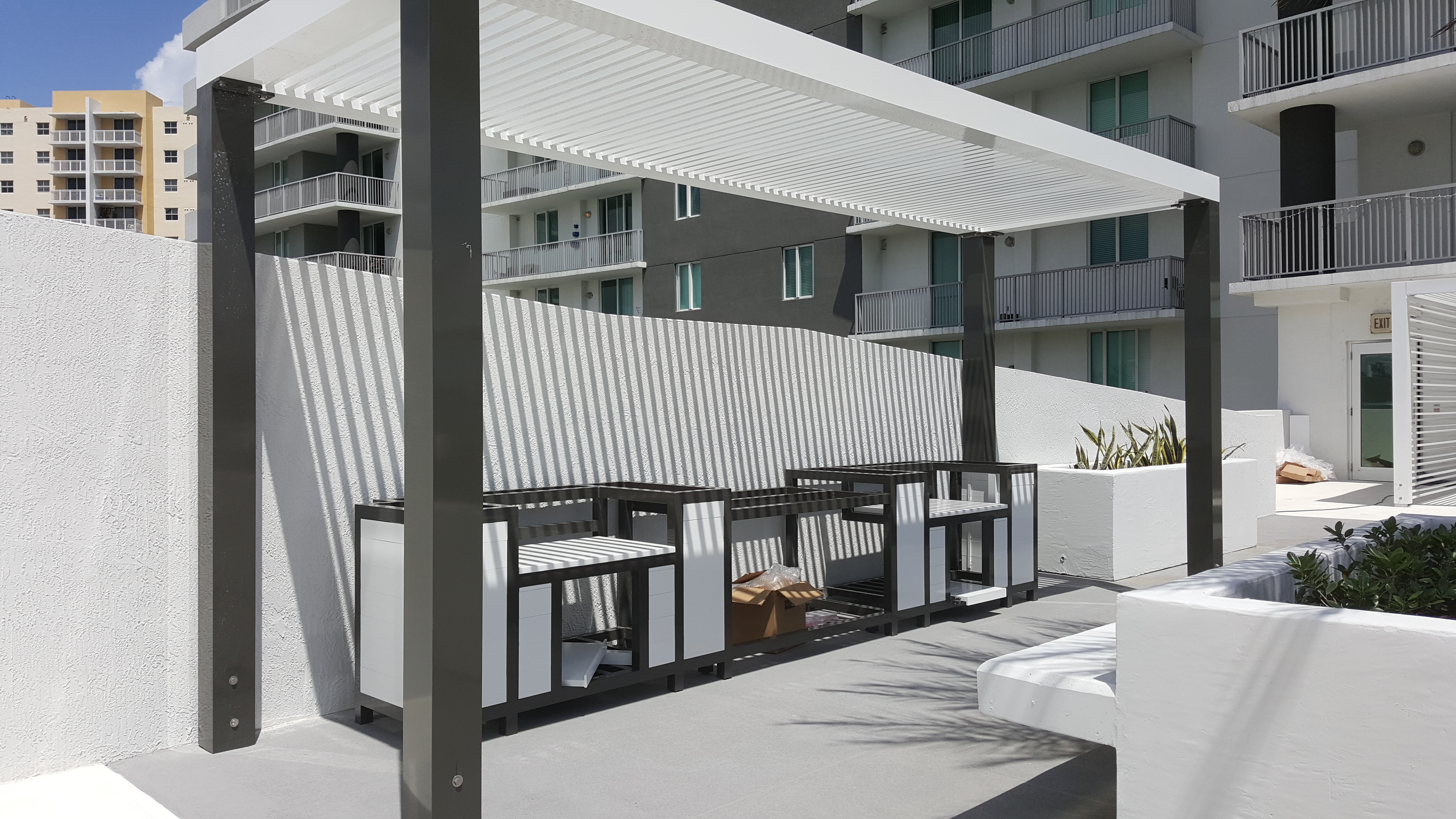 Custom BBQ grill and shade trellis, Modern Miami condominiums pool deck