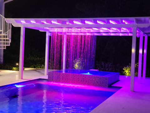 "Enhance your outdoor space with a custom aluminum pergola featuring a rain curtain, offering stylish shelter and protection from the elements."