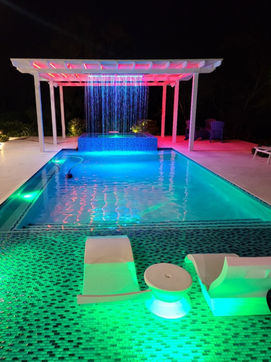 "Enhance your outdoor space with a custom aluminum pergola featuring a rain curtain, offering stylish shelter and protection from the elements."