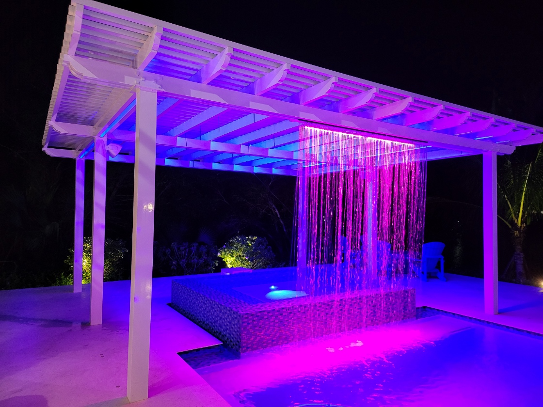 Shop walkthrough video still, aluminum pergola with rain-curtain feature
