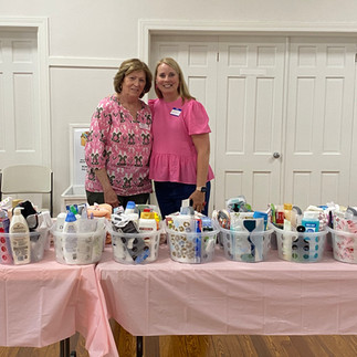 A table holding an assortment of caddies with toiletry items in them.