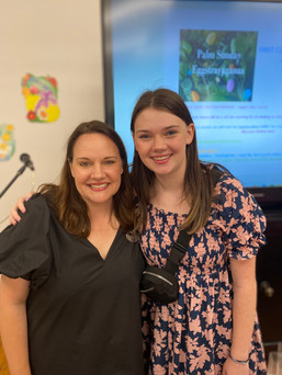woman and her teenage daughter standing together smiling