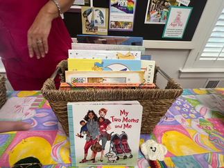 basket with banned books, including "My Two Moms and Me"
