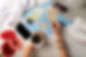 Top view woman planning a trip, drinking coffee and drawing on a map. Flat lay.jpg