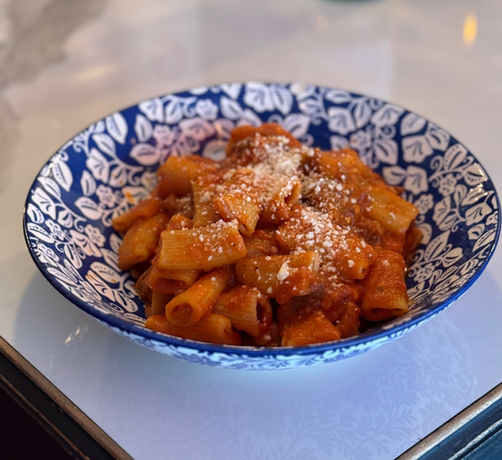 Fresh pasta with roasted eggplant in tomato sauce at Cafe Luce Italian restaurant in Midtown East Manhattan
