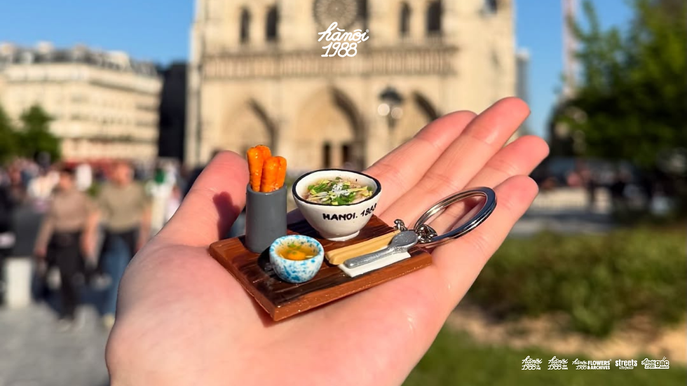 Miniature Vietnamese pho bowl keychain souvenir photographed near Notre-Dame in Paris