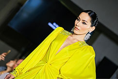 A model walks the runway at Melbourne Fashion Week (M/FW) in a vibrant chartreuse gown with crystal embellishments, styled by Tamarra McNaught, fashion and celebrity stylist and Creative Director for the show. Representing TITO STYLE, Tamarra curated this bold look as part of a striking runway collection in Melbourne, Australia.