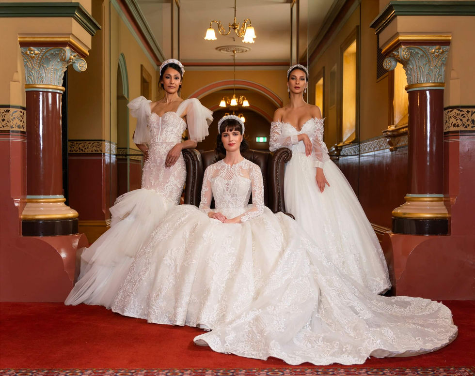Three brides in Jullia Bridal lace gowns in an ornate heritage corridor at The Hotel Windsor, Melbourne; creative direction and styling by Tamarra McNaught, founder of TITO STYLE.