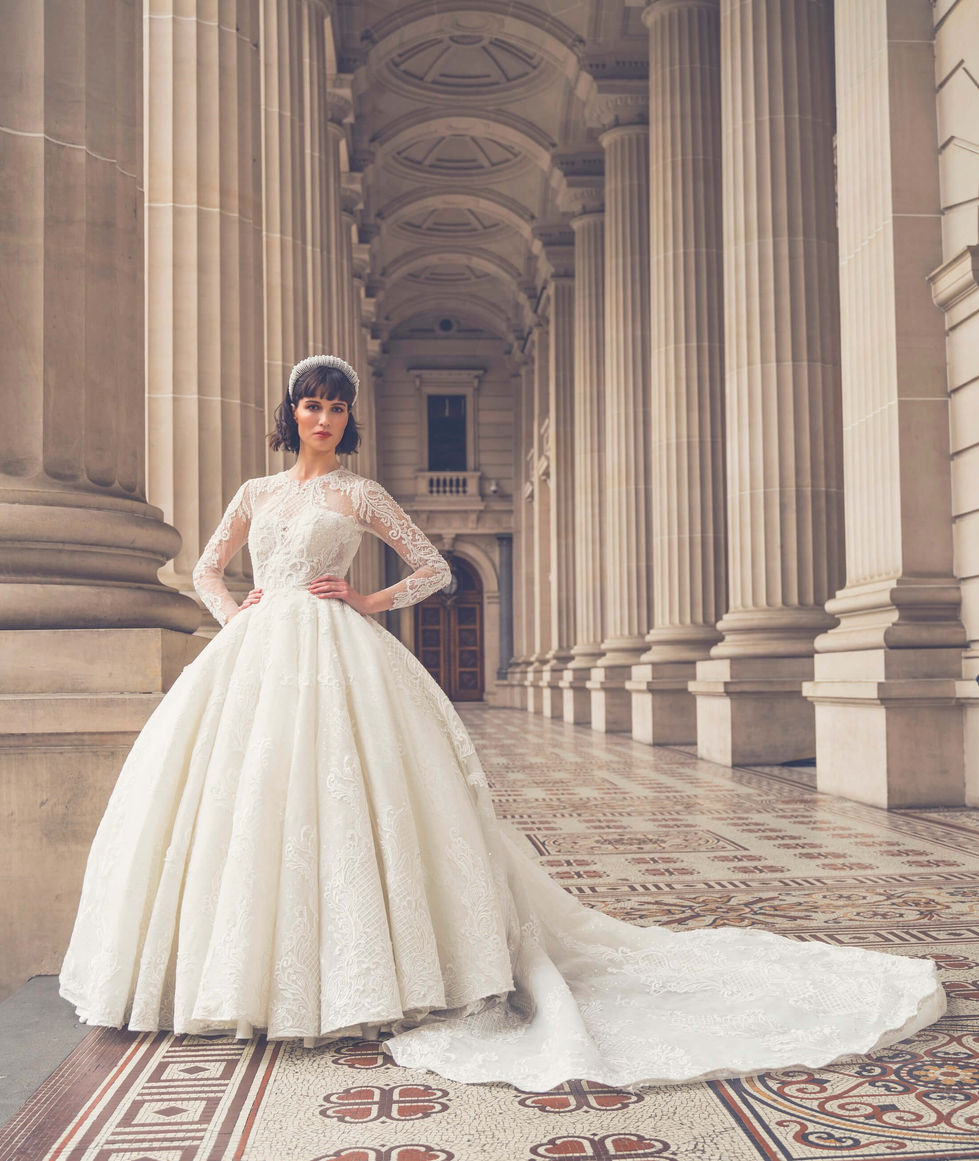 Bride in a Jullia Bridal lace ballgown beneath the columned portico of Parliament House, Melbourne; creative direction and styling by Tamarra McNaught, founder of TITO STYLE.
