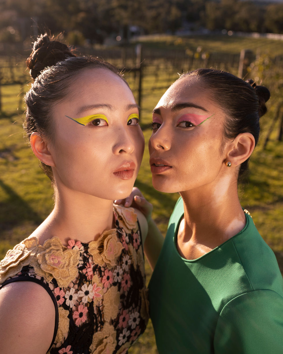 Two coloured looks styled together in golden afternoon light, with bold statement eye makeup. Moss & Spy looks, with creative direction and styling by Tamarra McNaught, founder of TITO STYLE, at Riverlea Estate, Warrandyte, Victoria, Australia.
