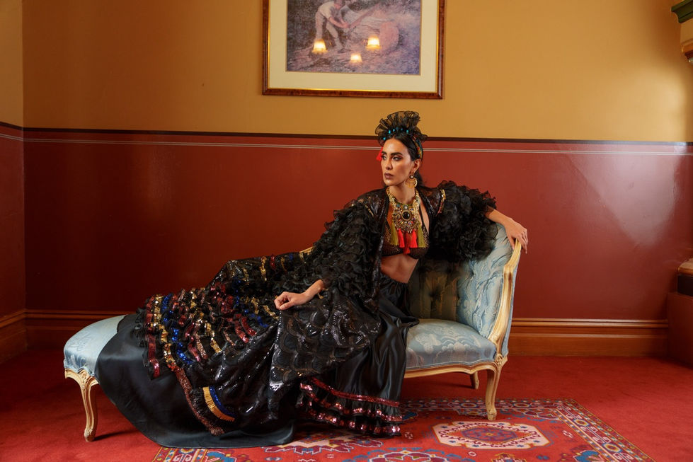 Model in a dramatic black embellished gown on an antique chaise, Creative Direction and styling by TITO STYLE stylist Tamarra McNaught, The Windsor Hotel, Melbourne.