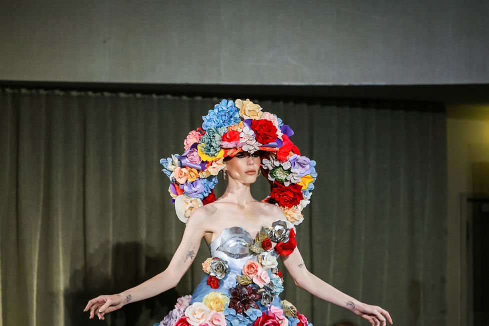 A multicolour floral gown with an oversized floral headpiece. A Curl Paper look, with creative direction and styling by Tamarra McNaught, founder of TITO STYLE, at The Hotel Windsor, Melbourne, Australia.