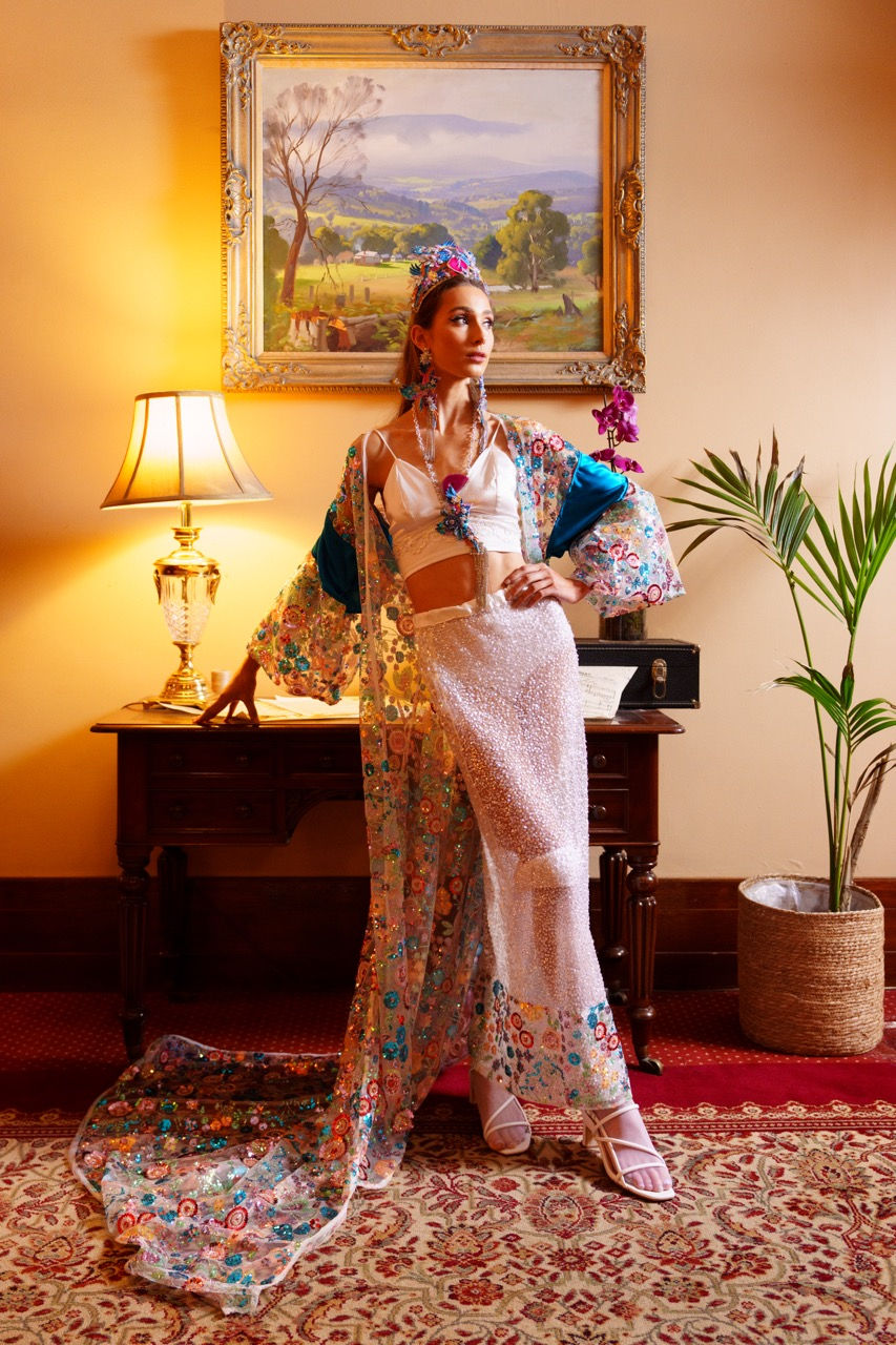 Model in sheer white couture at the grand ballroom doorway, styling by Melbourne stylist Tamarra McNaught of TITO STYLE, Harlow Loves Daisy.