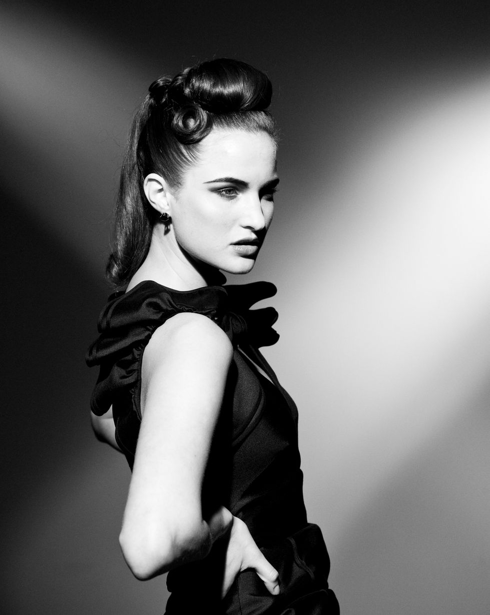 A dark vintage updo shot in profile. Hair by Yoshiko Hair, with styling by Tamarra McNaught, founder of TITO STYLE, at Idea Studios.