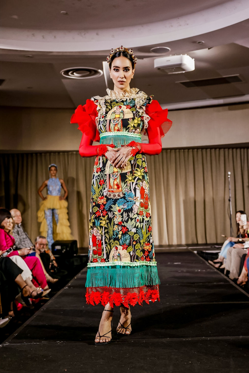 A richly embroidered gown with red ruffled sleeves. A Judith Penak Couture look, with creative direction and styling by Tamarra McNaught, founder of TITO STYLE, at The Hotel Windsor, Melbourne, Australia.