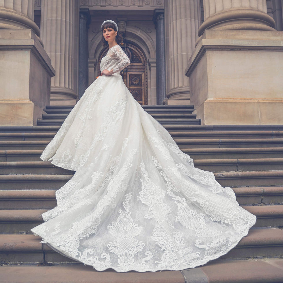 Bride in a Jullia Bridal lace ballgown with a sweeping train down the stone steps of Parliament House, Melbourne; creative direction and styling by Tamarra McNaught, founder of TITO STYLE.