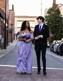 junior prom dress with matching tie walking