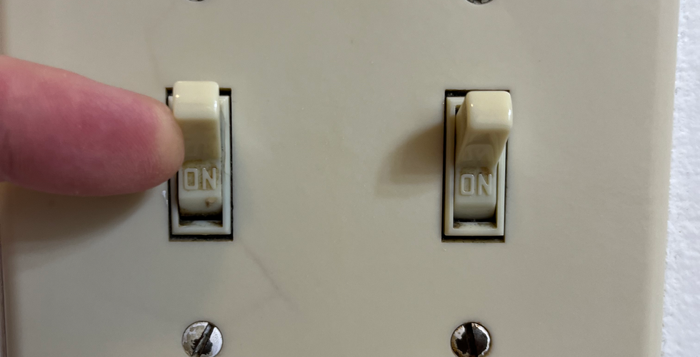 Before photo of dirt and grime in tight spots on the light switch