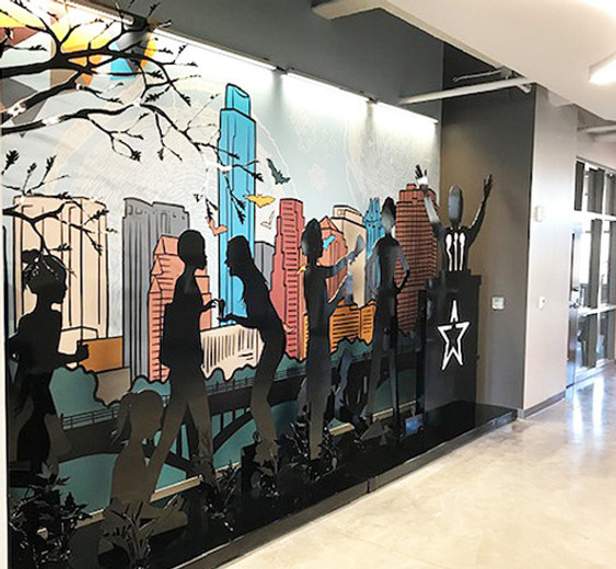 CNC cut out images of girls in park Ann Richards School