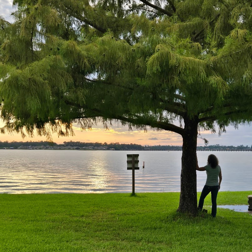 Me standing by the tree overseeing the lake