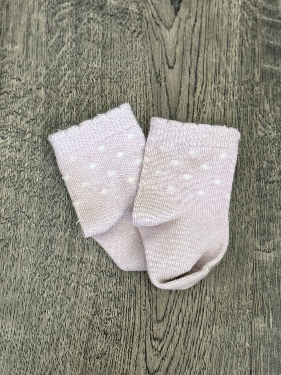 neutral colored baby socks with white polka dots