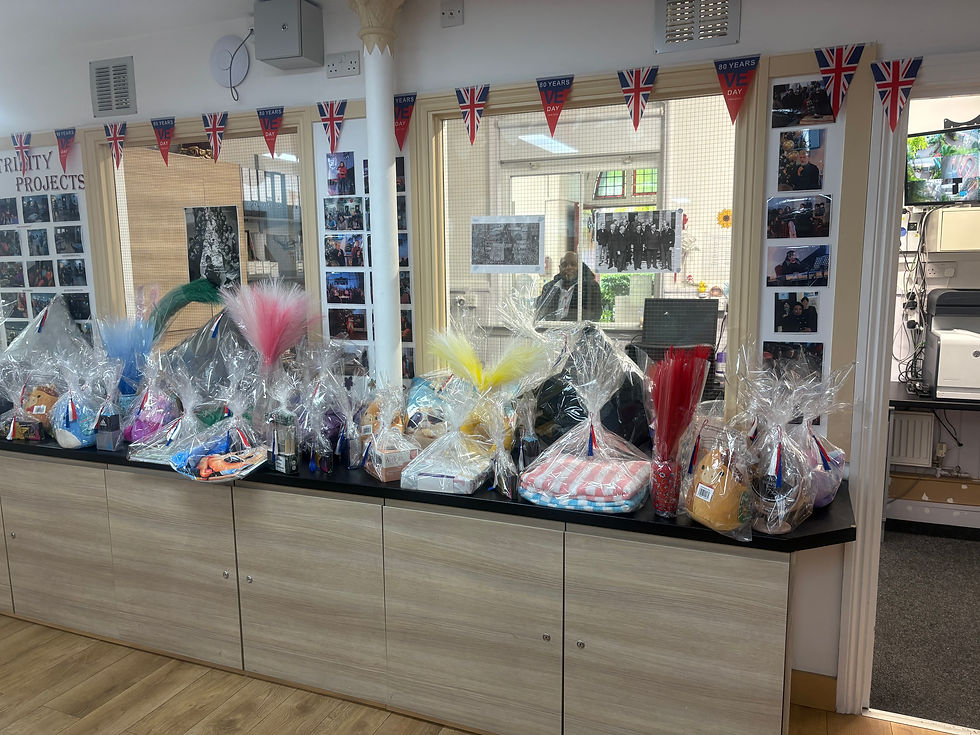 All the Raffle prizes in lovely baskets piled up on our counters before the event