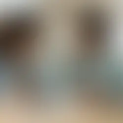 A young couple using a laptop to navigate the AEC Insure digital portal for health insurance enrollment and financial planning.