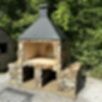 Stone outdoor kitchen fireplace with black chimney hood