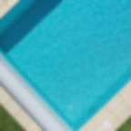 Aerial view of a custom patio and swimming pool edge