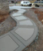 Curved concrete walkway with decorative borders