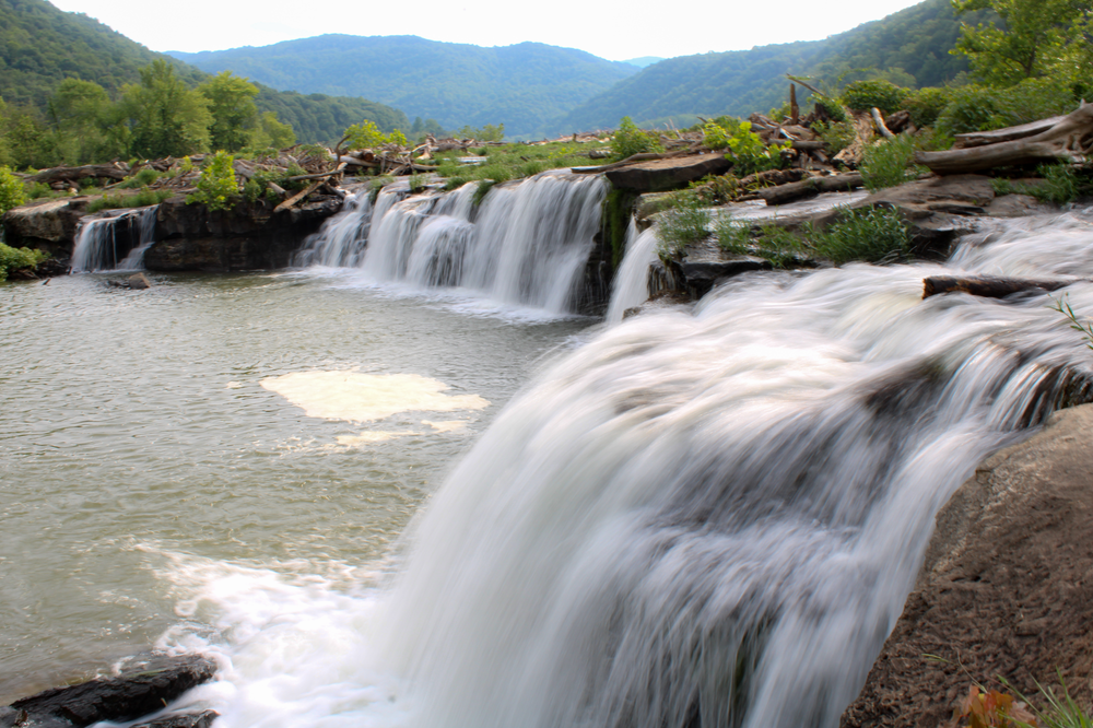 Waterfalls with mountains in the background