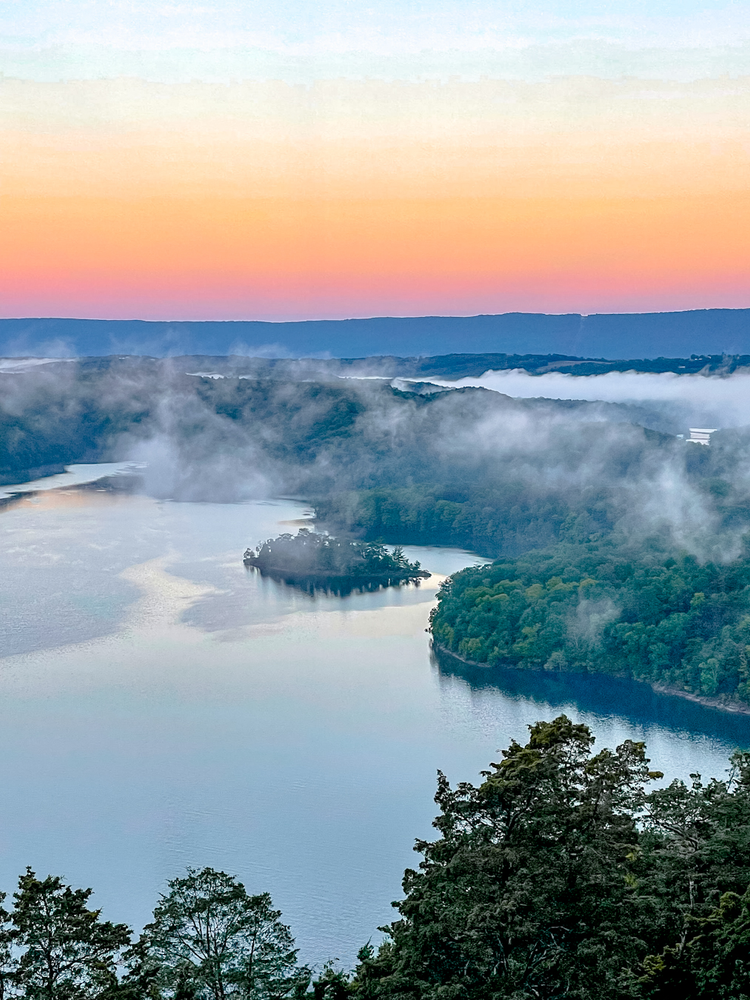 Fog over a lake at sunrise