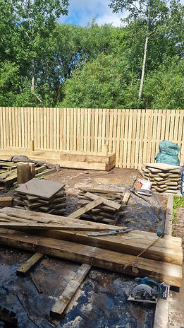 Construction site with stacked wooden planks