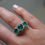 Thumbnail: 2.2 Carat Round Emerald Three Stone Halo Ring