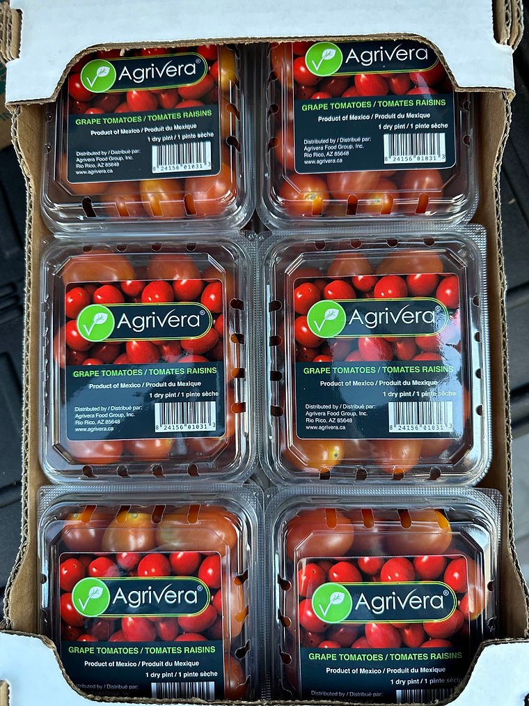 Grape tomatoes in clamshell packs