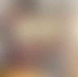 A display case featuring the book “Pioneer Quiltmaker: The Story of Dorinda Moody Slade” next to the historic quilt she created.