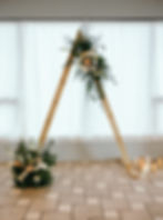 Triangle wooden wedding arch with faux floral rentals Maryland