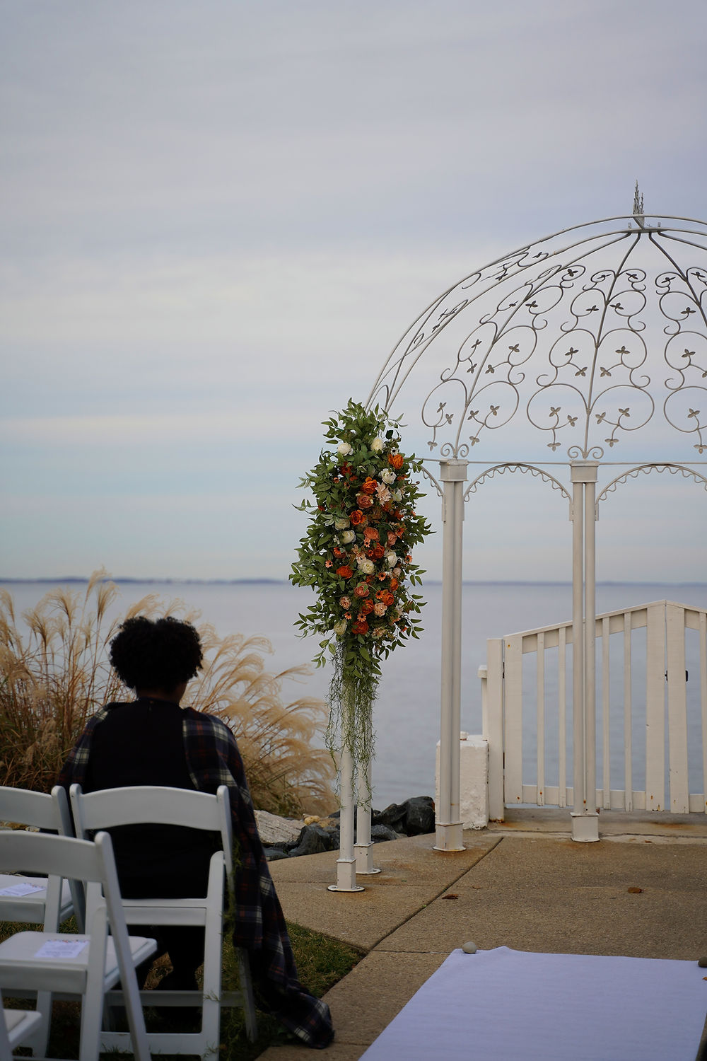 Wedding arch rentals Maryland at waterfront ceremony